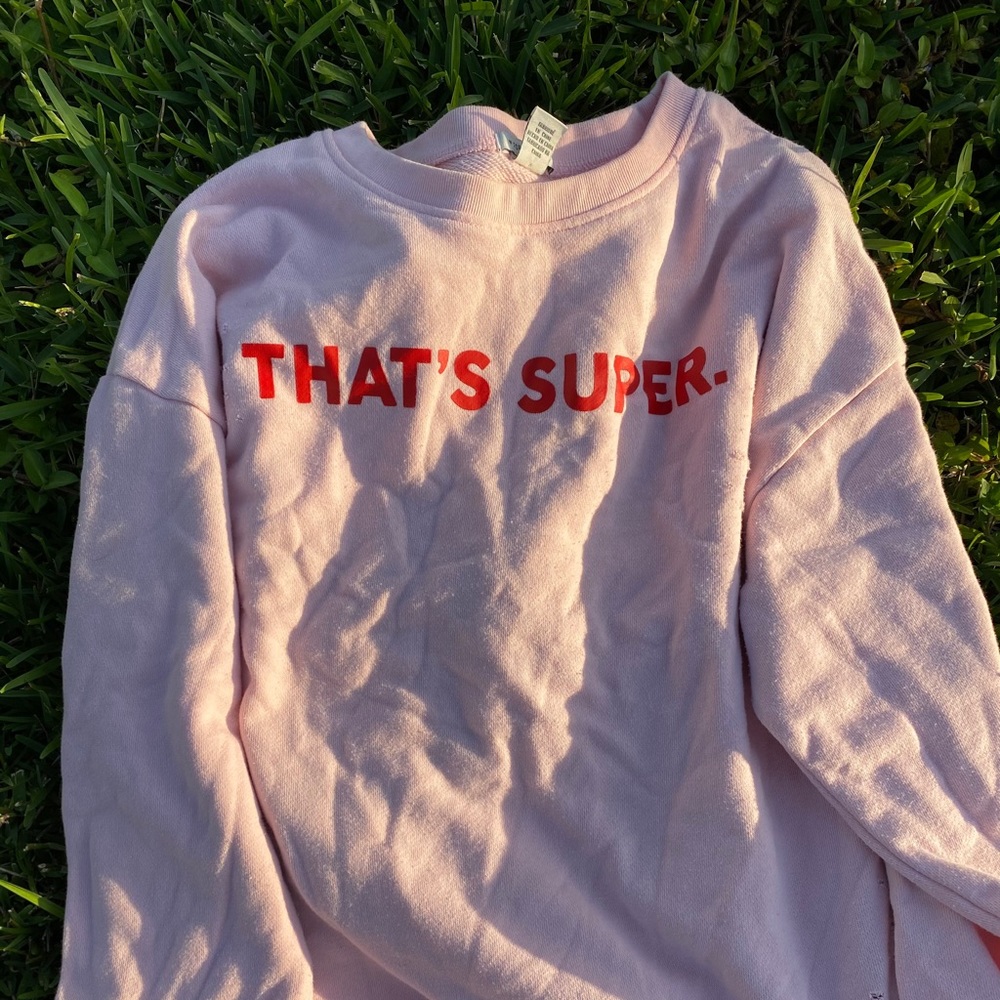 Pink sweatshirt with coral writing